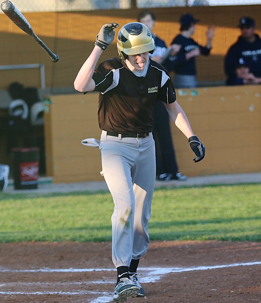 Image: Clayton “Bruiser” Miller shakes off the sting after being nailed by a pitch. Bruiser wasn’t done yet and would later be hit by another pitch from the Cougars.