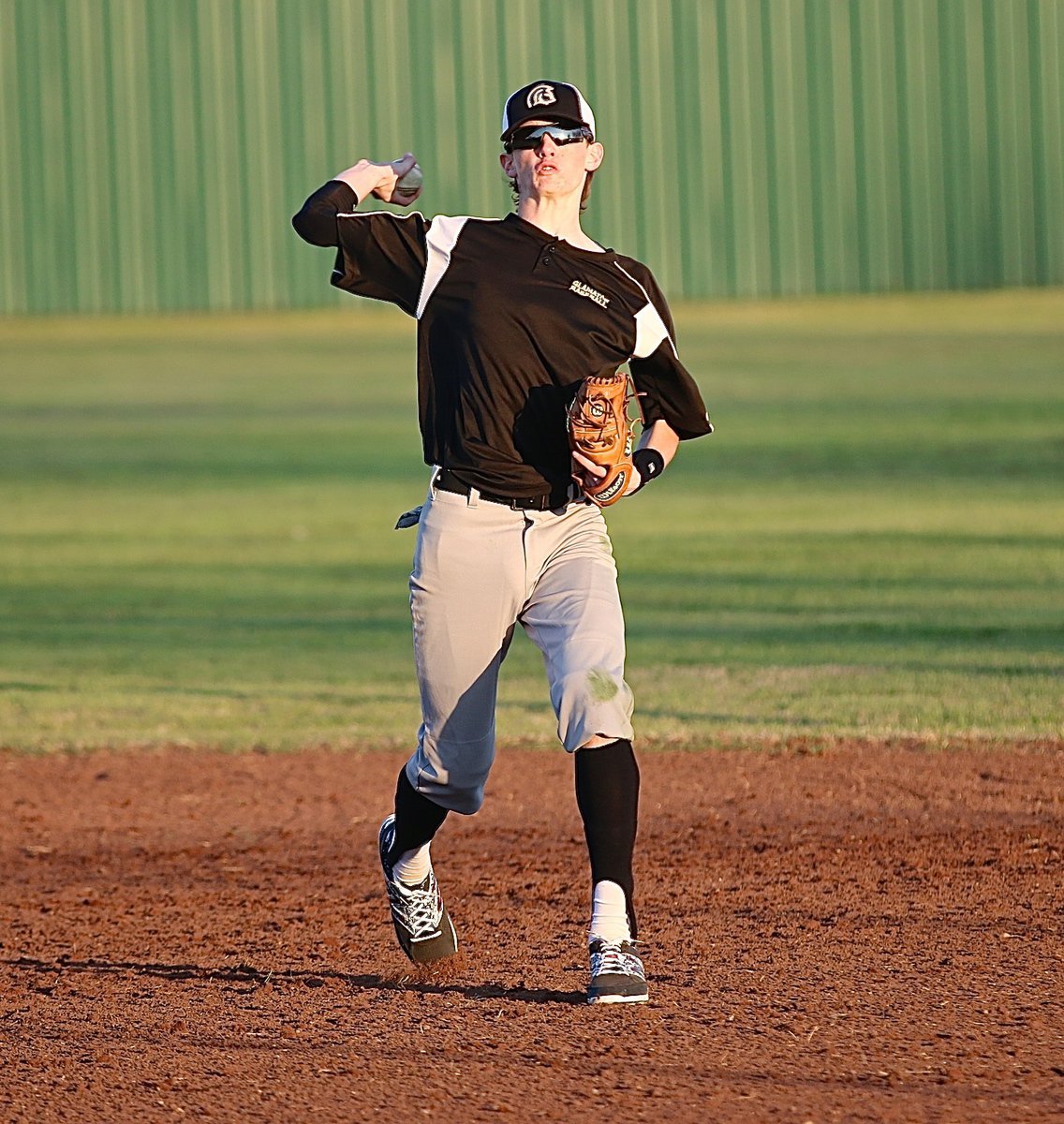 Image: Ty Windham gets loose at second-base for the Gladiators.