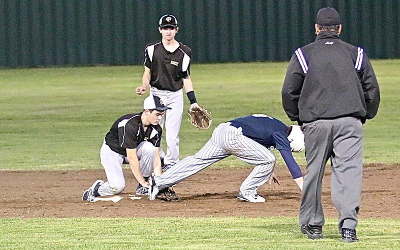 Image: Kyle Tindol tags a stealing Cougar out at second-base with teammate Garrett Janek backing up the throw.