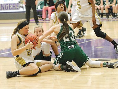 Image: Lady Gladiators Lillie Perry(24) and Taleyia Wilson(14) scratch and claw with two Santo Lady Cats for a loose ball.