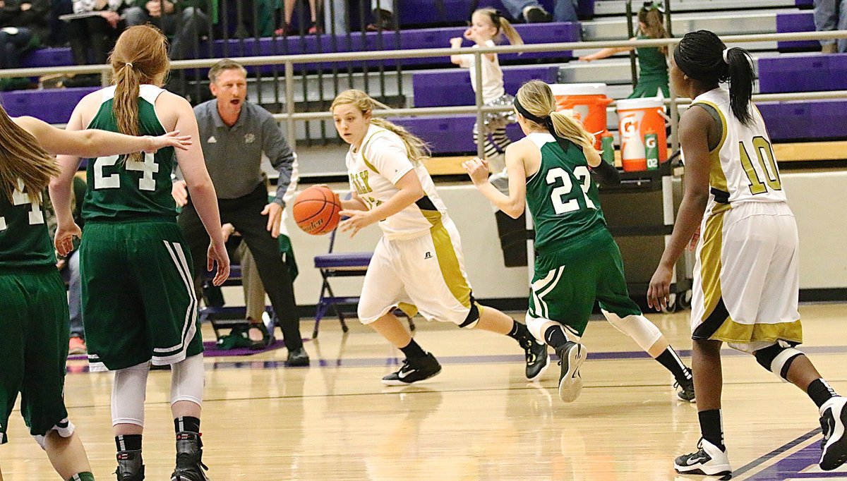 Image: Lady Gladiator Brycelen Richards(13) receives the inbound pass from teammate K’Breona Davis(10) and then dribbles out of the corner.