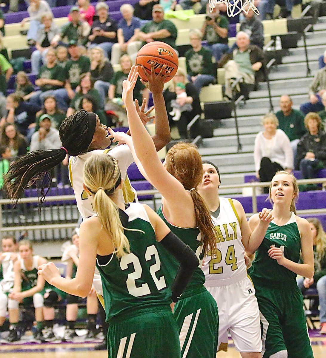 Image: Italy’s Kortnei Johnson(3) Charges to the hoop against Santo with teammate Lillie Perry(24) in good rebounding position.