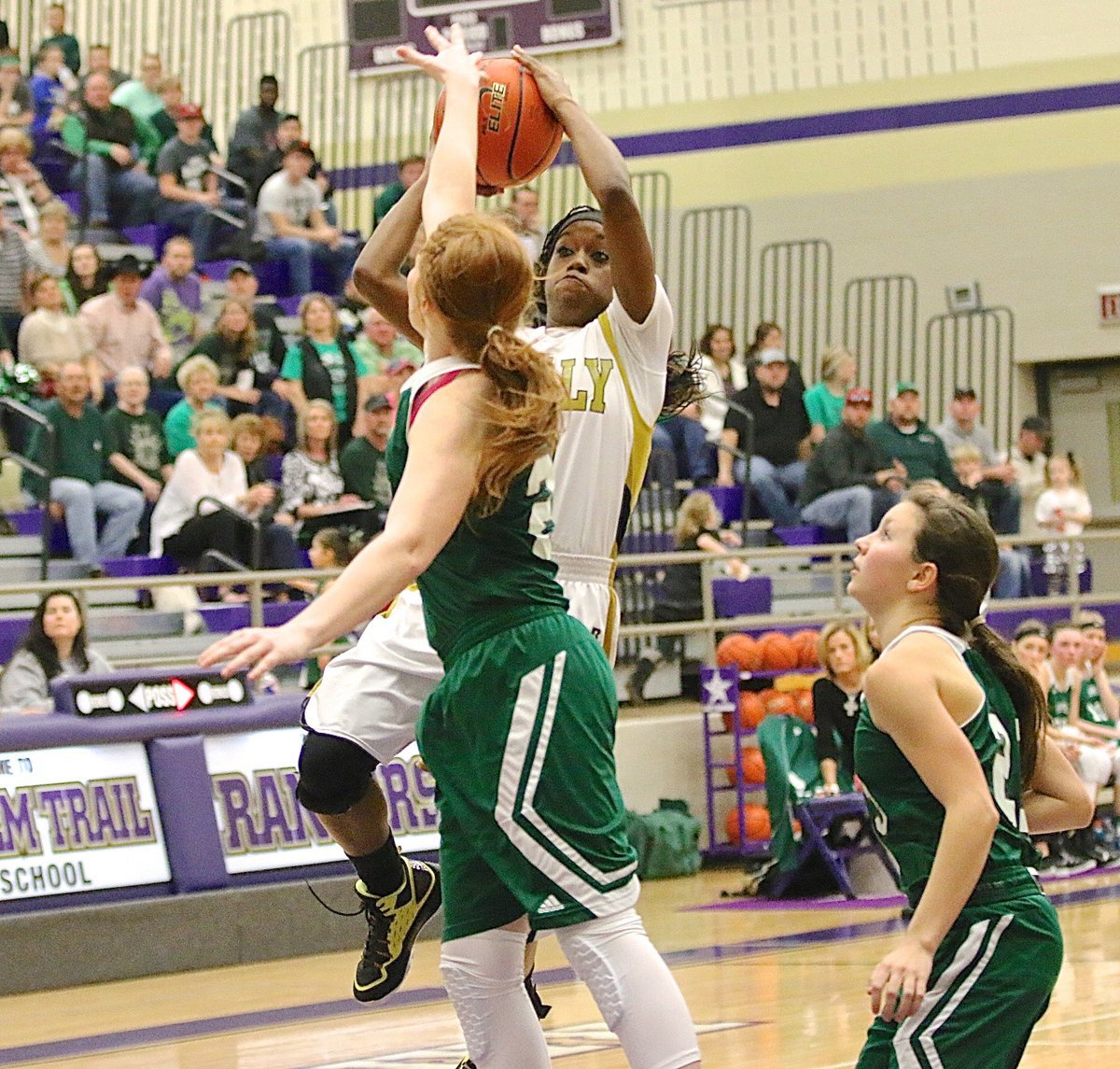 Image: Lady Gladiator senior Kortnei Johnson(3) keeps attacking the basket against Santo.