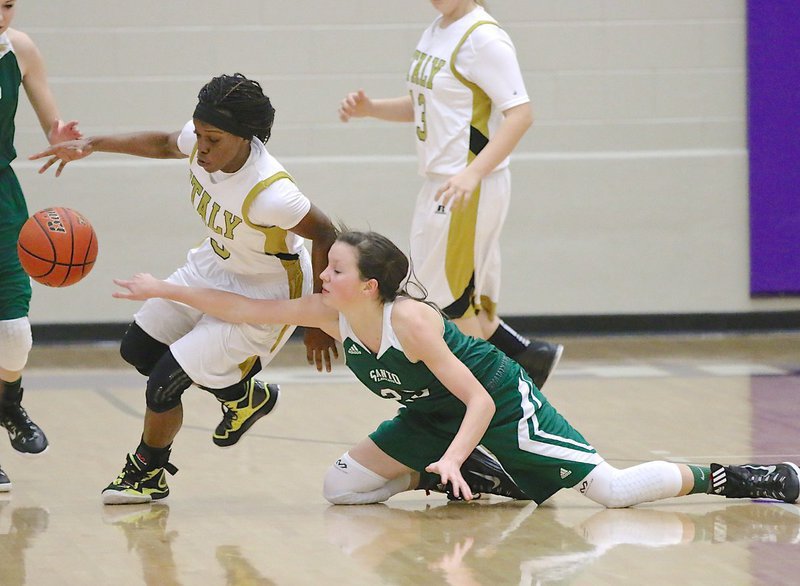 Image: Kortnei Johnson(3) tries to create a steal and break away against Santo.