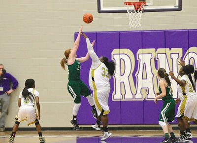 Image: Lady Gladiator Cory Chance(33) forces a missed shot attempt from Santo.