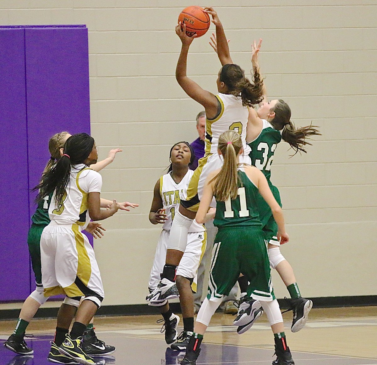 Image: Italy’s Emmy Cunningham(2) out leaps Santo for an offensive rebound.