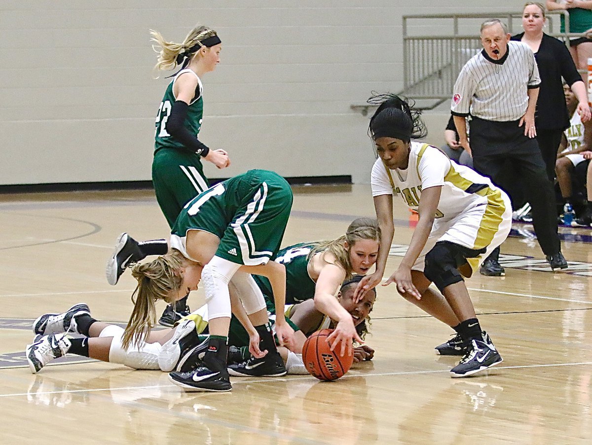 Image: Italy’s Lady Gladiators and the Santo Lady Cats gave it all they had, but in the end, it was Santo who emerged from the area playoff pileup victorious, 57-52.