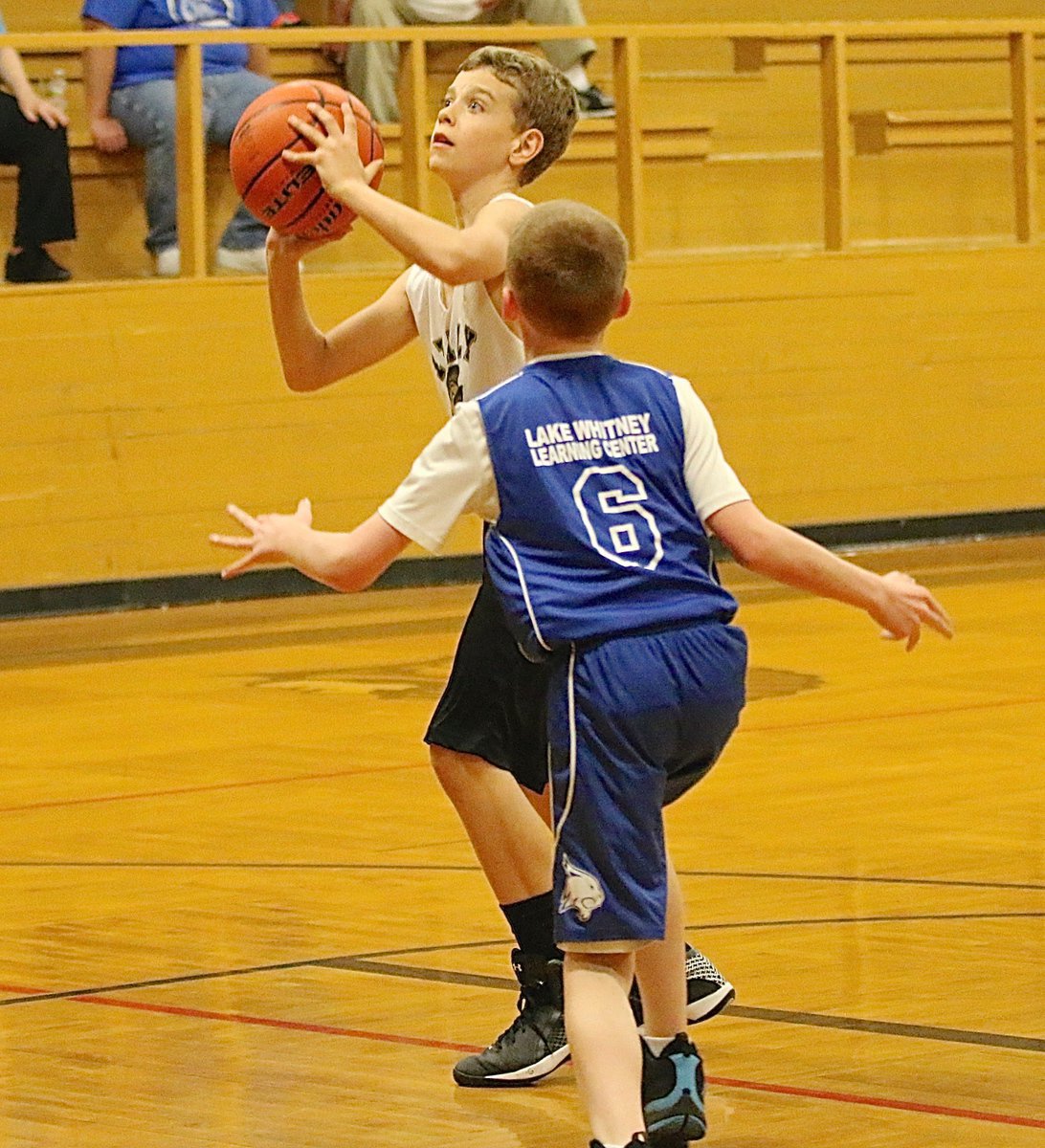 Image: Creighton Hyles(11) takes his shot after Whitney’s defense lost sight of the elusive big man in the lane.