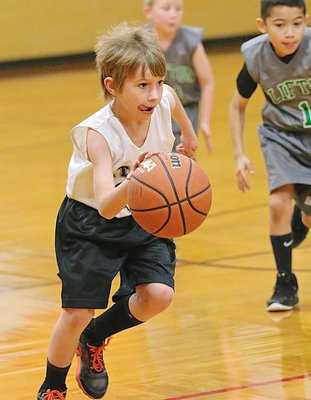 Image: Levi Joffre(6) hurries the ball across mid court against Clifton.