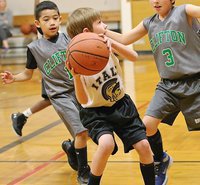 Image: Levi Joffre(6) shoots over a pair of Clifton defenders.