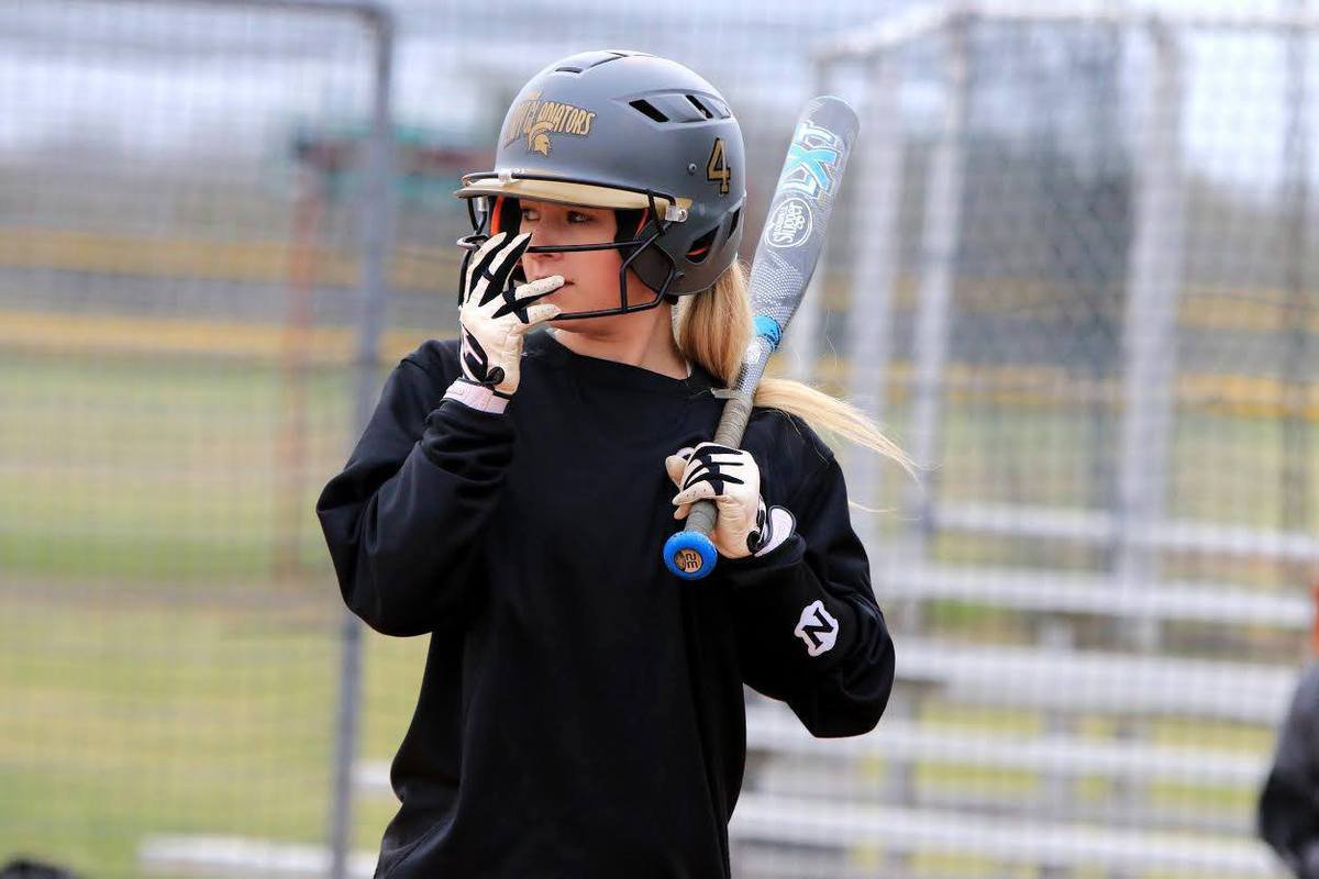 Image: Lady Gladiator junior Britney Chambers settles in at the plate with the look of a Champion.