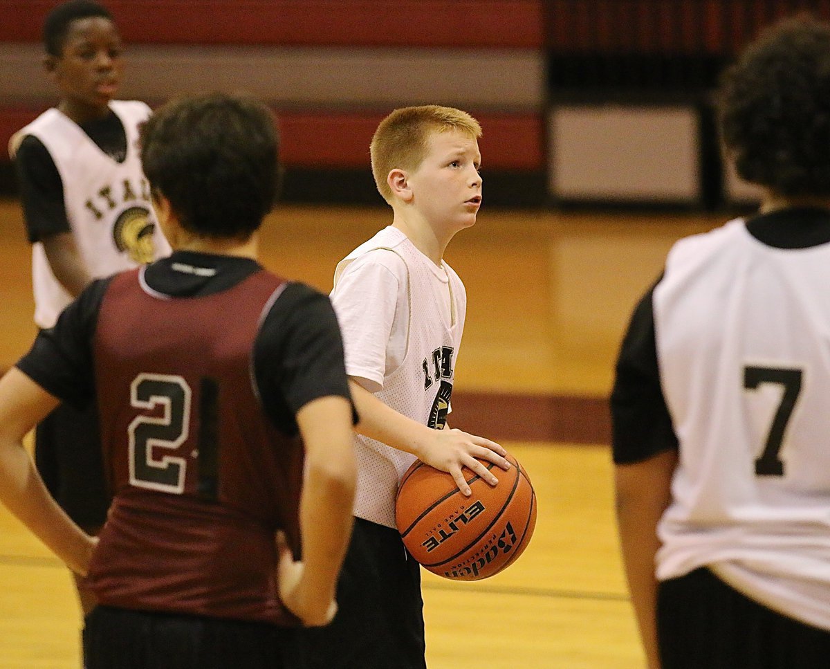 Image: Ty Cash(10) takes a couple of chances from the free throw line.