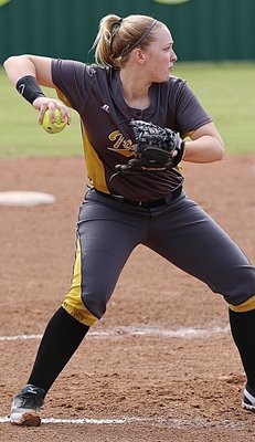 Image: Jaclynn Lewis(15) covers a grounder hit to the mound and throws for the out at first-base. Lewis also made a diving catch for an out near the mound later in the contest.