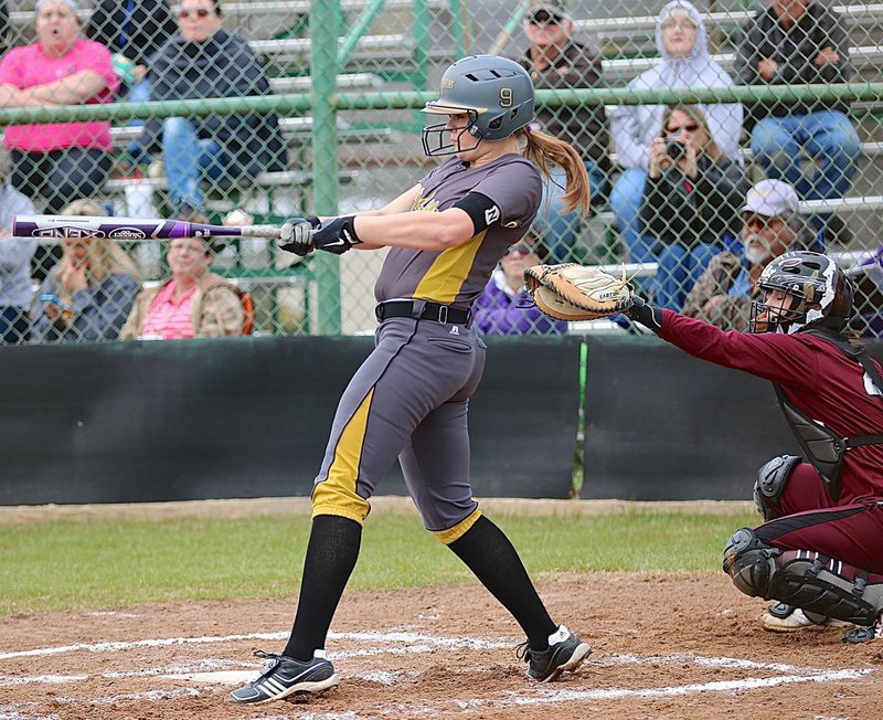 Image: Lady Gladiator Lillie Perry(9) crushes a ball into the Mildred outfield.