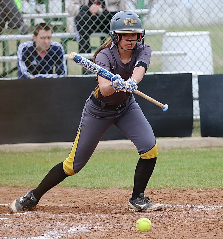 Image: Lady Gladiator April Lusk(7) bunts and runs extremely fast to first-base.