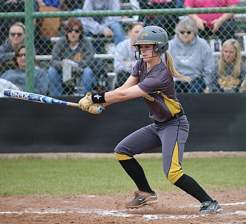 Image: Bailey Eubank(1) hits the ball into play for the Lady Gladiators.
