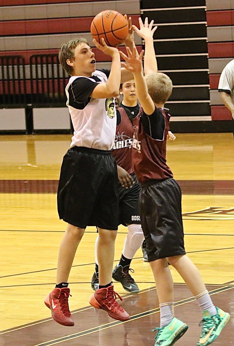 Image: Grant Hamby(9) rises for a jumper over a Hillsboro defender.