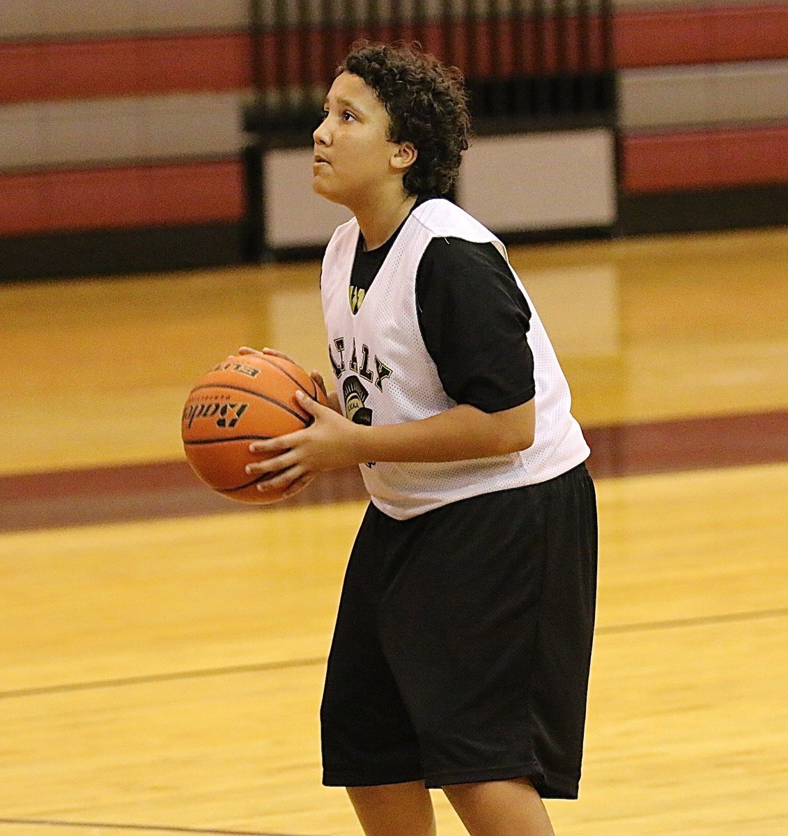 Image: Evan Cunningham(7) takes a turn at the free throw line.