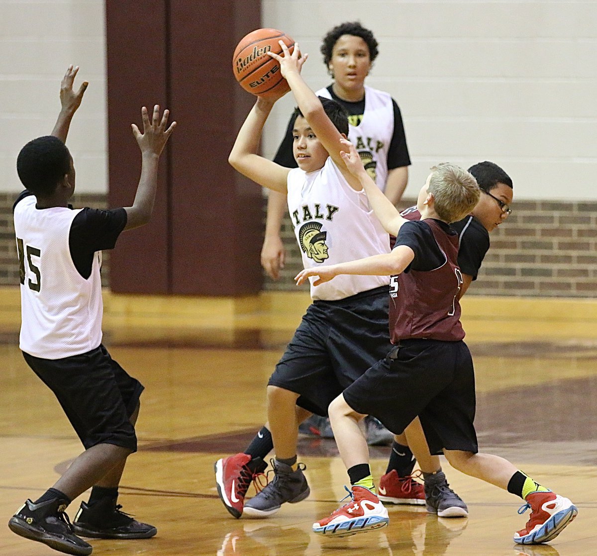 Image: Omar De La Hoya(6) rebounds a miss and passes to an outlet.