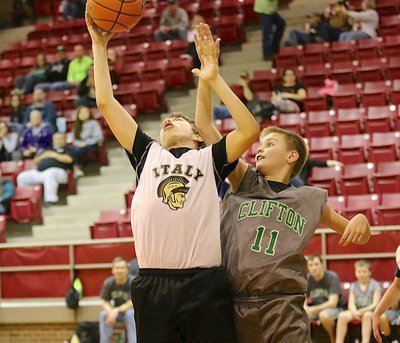 Image: Grant Hamby(9) outstretches a Clifton player for a rebound.