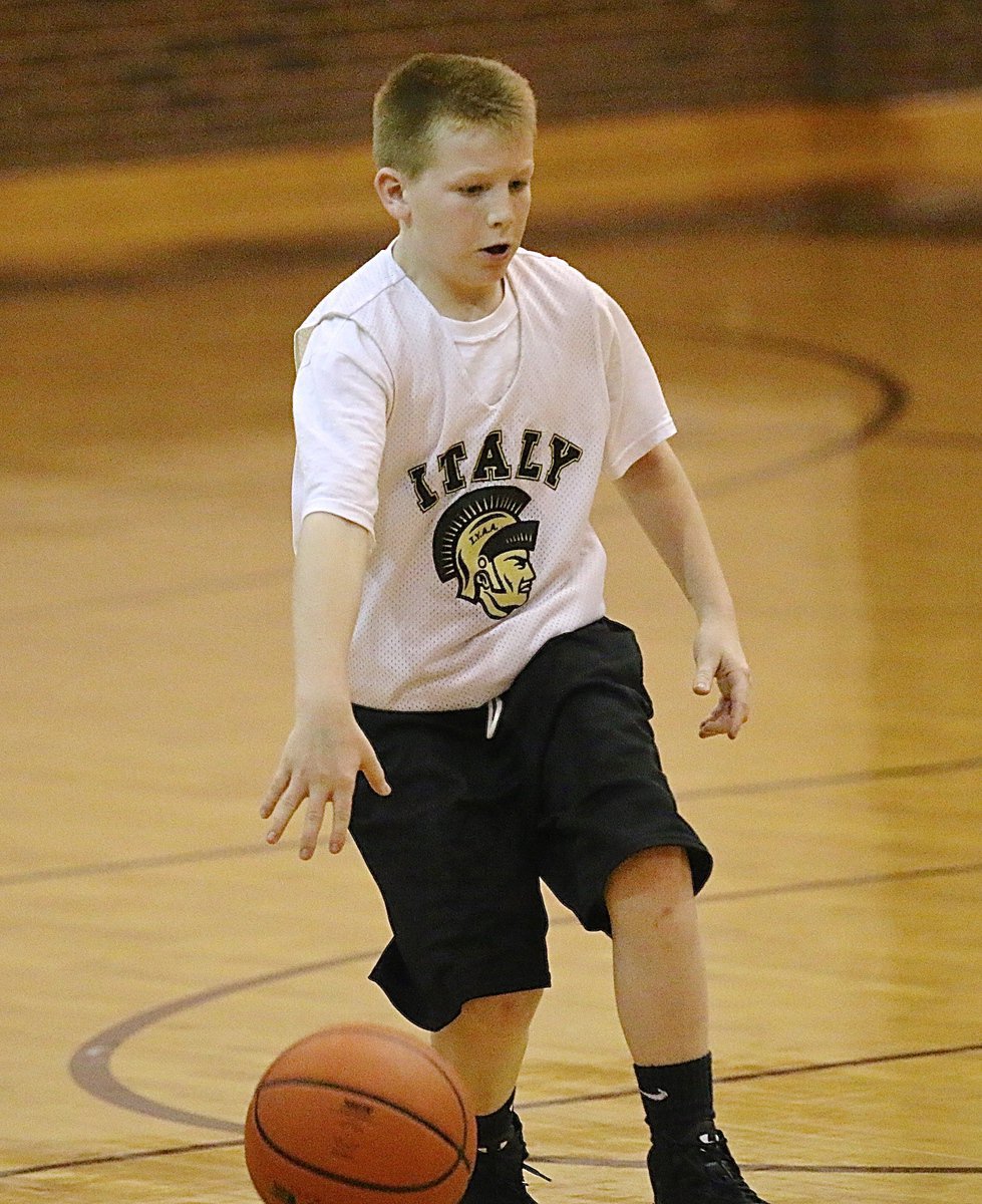 Image: Guard Ty Cash(10) brings the ball up court for Italy.