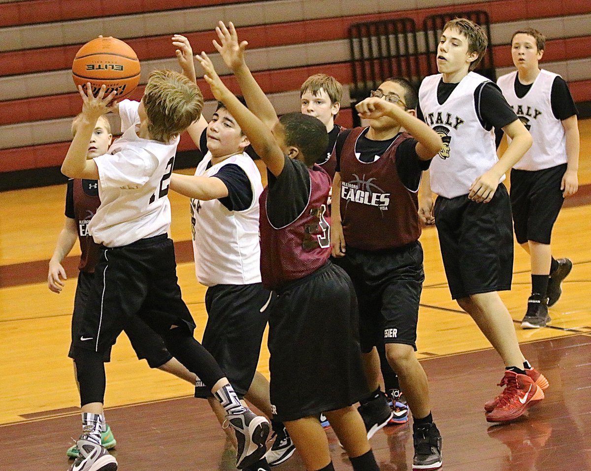 Image: Reese Janek(12) rebouns the ball and goes up with a shot for Italy.