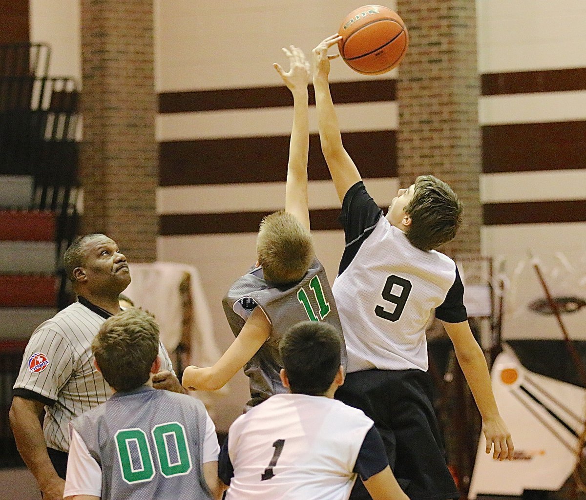 Image: Italy’s Grant Hamby(9) controls the opening tip versus Clifton during their second matchup of the 2015 Hillsboro Boys Basketball Tournament. Italy played 5 games on Saturday and finished in 2nd Place.