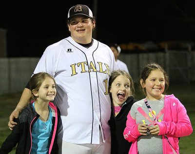 Image: Celeb status: Senior Gladiator John Byers signs autographs and poses with some of his biggest little fans including Grace Patton and Maddie Patton in from Harper, Texas and and pee-wee Lady Gladiator Ella Hudson.