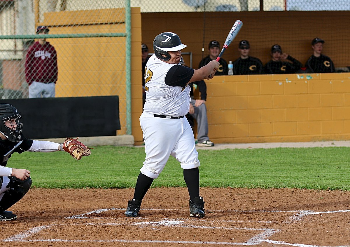 Image: Pedro Salazar(12) powers a single shot past the Crandall infield.