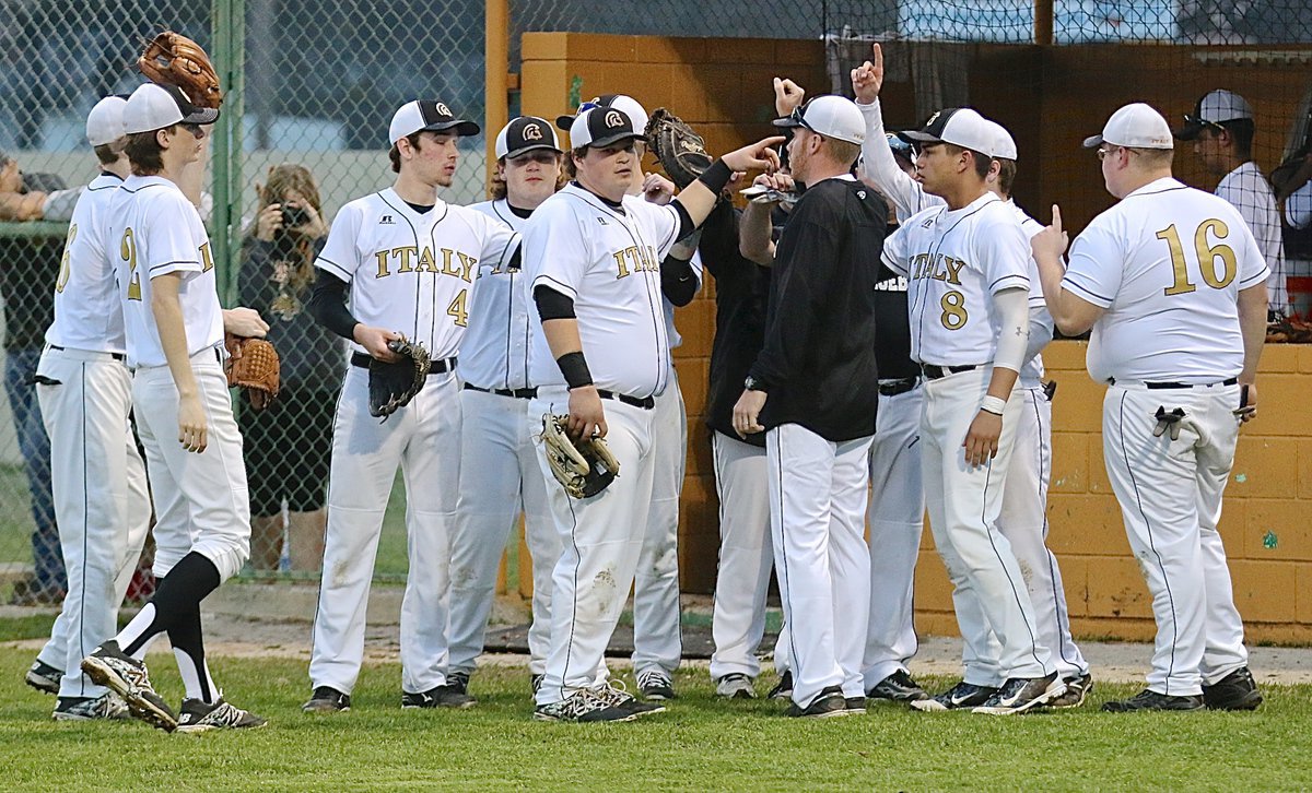 Image: Gladiator head coach Jon Cady fires up his troops to start the second-inning against Faith Family.