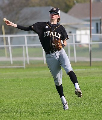 Image: Gladiator Ty Windham(12) is enthusiastic while playing shortstop.
