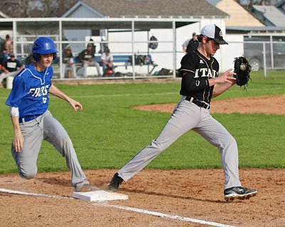 Image: Gladiator pitcher Ryan Connor(4) covers first-base to beat the Frost runner for an Italy out.