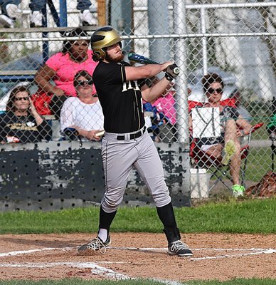 Image: Senior Gladiator swatter Kyle Fortenberry(14) rips a single into the Frost outfield. Fortenberry would later hit a double.