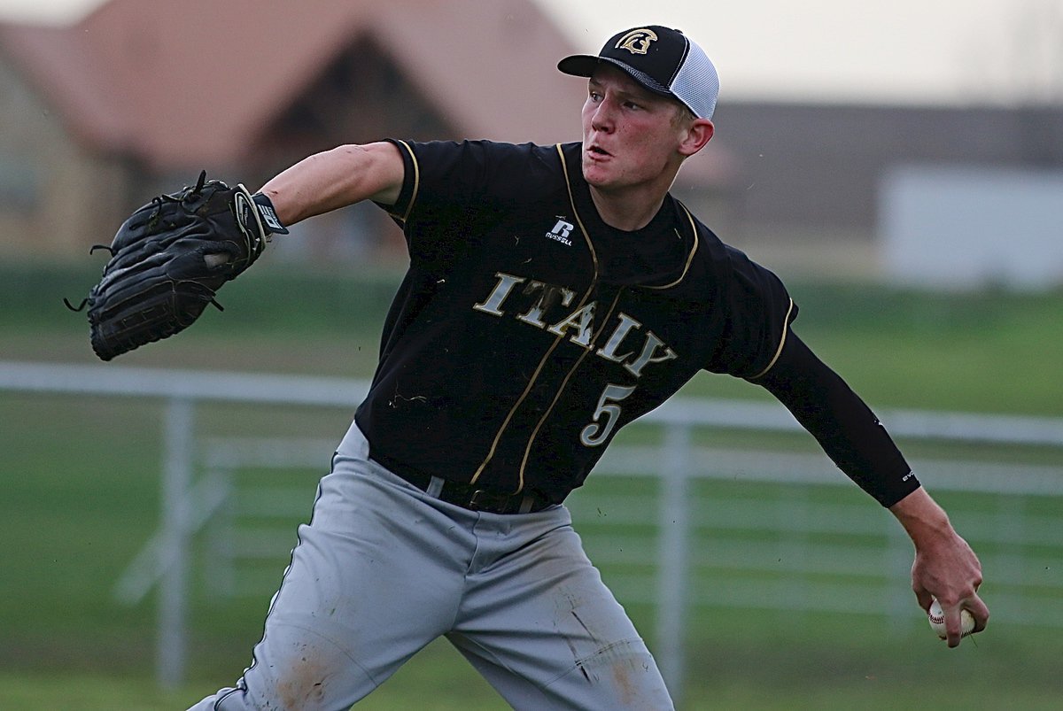 Image: After a diving effort, senior right fielder Cody Boyd(5) bounds to his feet, collects the ball and relays it in.