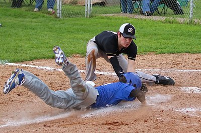 Image: Italy pitcher Ryan Connor(4) and catcher John Escamilla team up to tag a Frost runner out who tried to steel home.