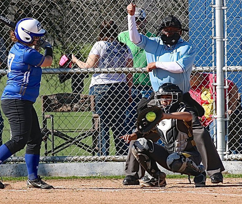 Image: Lady Gladiator catcher April Lusk(7) pulls in a strike three from her pitcher Jaclynn Lewis.