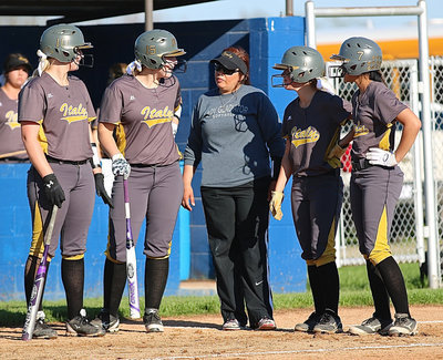 Image: Madison Washington(10), Jaclynn Lewis(15), Lady Gladiator head coach Tina Richards, Bailey Eubank(1) and April Lusk(7) talk it over late during their district duel against Frost.