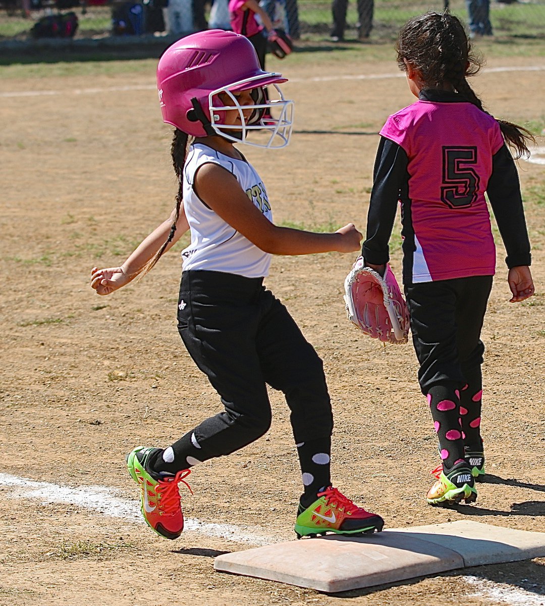 Image: Jordynn Wiser reaches first base for Italy’s T-ball girls.