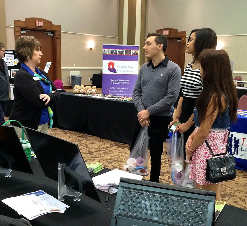 Image: Seniors Chace McGinnis, Alex Minton and Ana Luna talking with local college representatives.