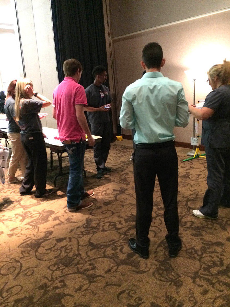 Image: Seniors Gary Kinkaid and Jack Hernandez playing a biology game with Navarro Physical Therapy Instructors.