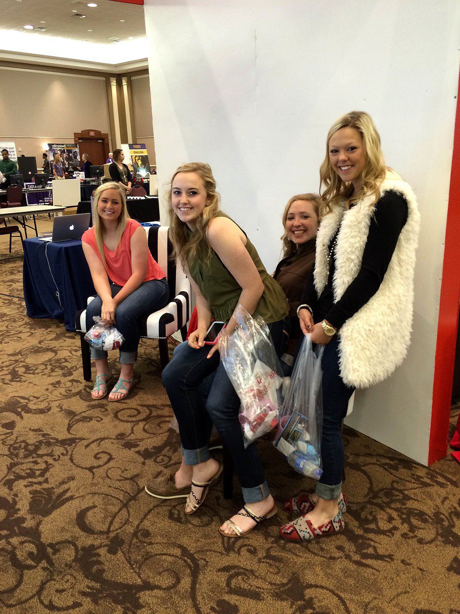 Image: Seniors Madison Washington, Kelsey Nelson, Jaclynn Lewis and Bailey Eubank taking a break between visits with colleges and local businesses.