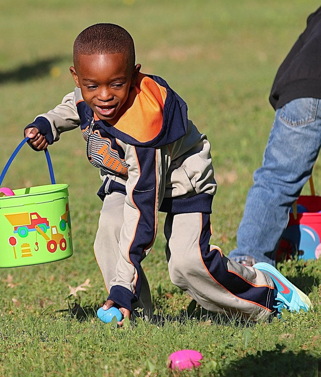 Image: Ja’llyn gets to work scooping up Easter eggs.