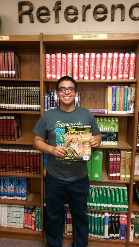 Image: Isaac Garcia holding the May/June issue of Texas Trophy Hunters Magazine where his article is published