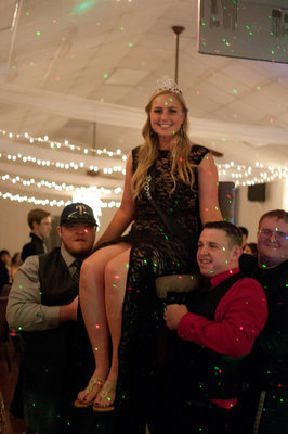 Image: Queen Madison Washington is carried by Nathan Kerbow, Austin Crawford, and Colin Newman