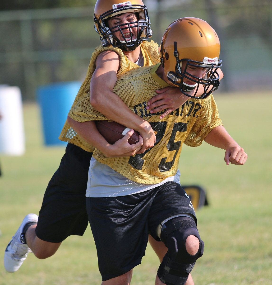 Image: Gary Escamilla attempts to rip the ball away from teammate Alex Garcia.