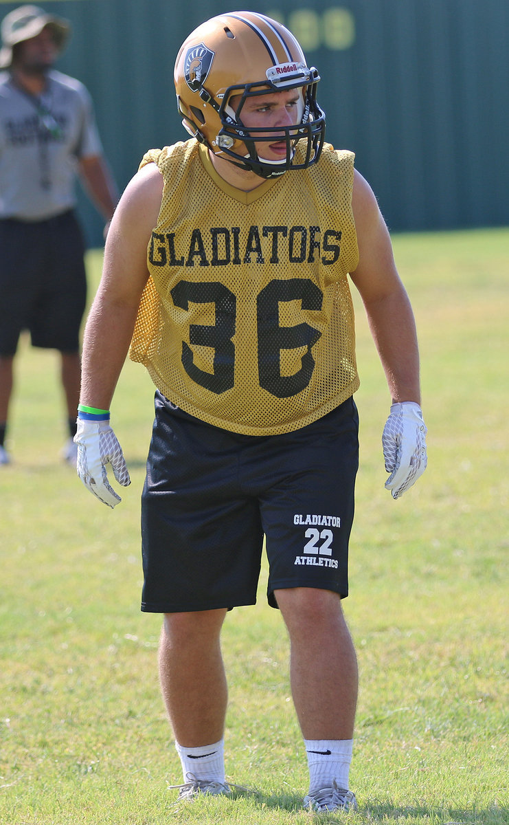 Image: Outside linebacker Hunter Merimon(36) settles in before the snap during team drills.