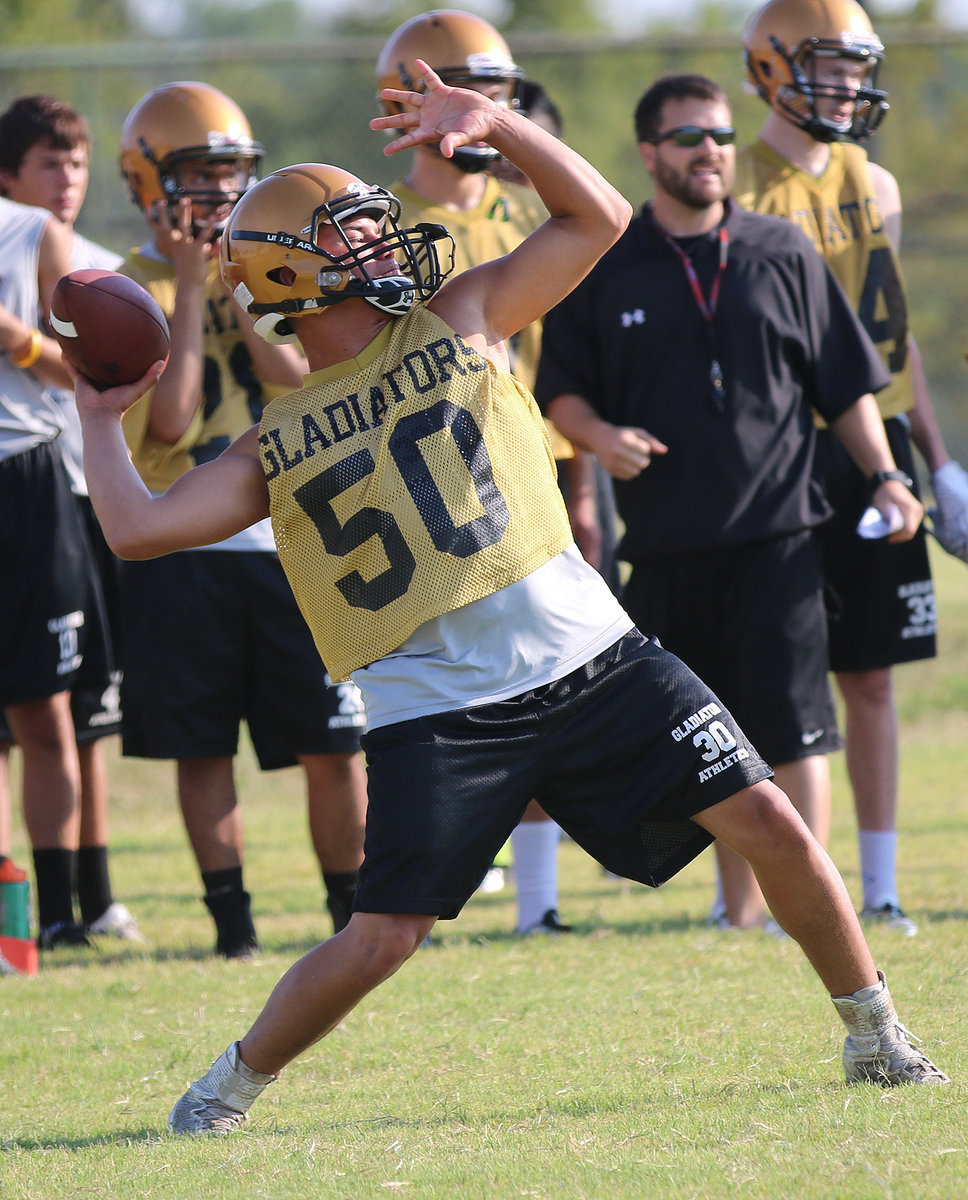 Image: Quarterback Joe Celis(50) let’s it fly during during Tuesday’s practice.