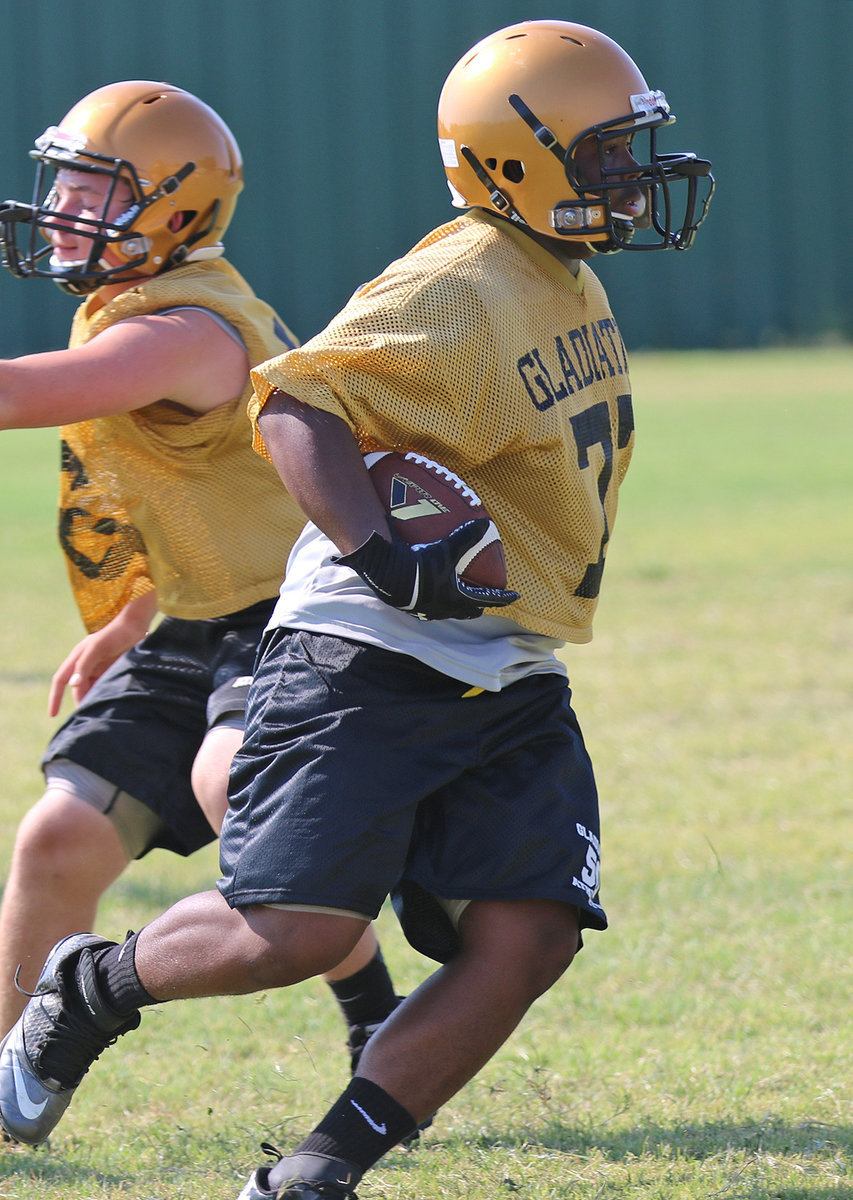 Image: Linebacker Kenneth Norwood, Jr.(77) intercepts a pass during team drills.