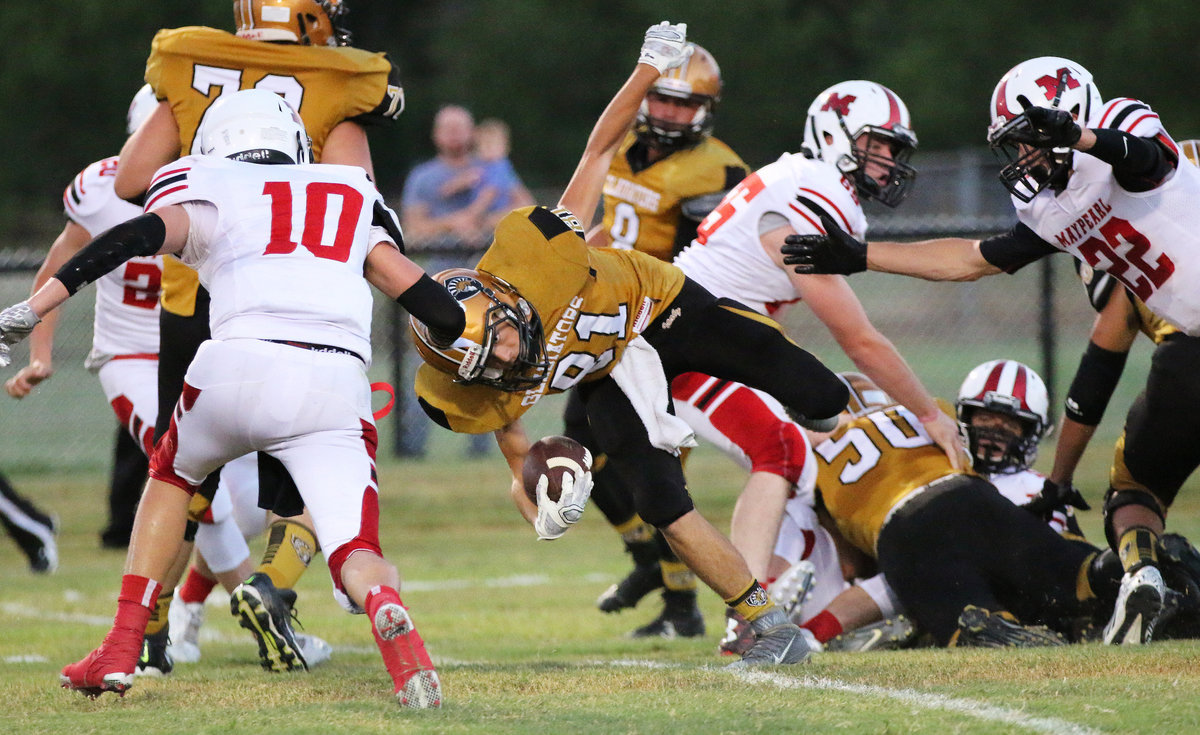 Image: Gladiator Fullback Dylan McCasland(81) is nimble as he maneuvers his way forward for positive yards against Maypearl.