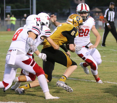 Image: Gladiator and senior receiver Clayton Miller(6) hauls in a pass and then turns up field with Panthers closing in.
